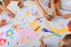 Family creating nativity ornaments as a faith-based Christmas craft